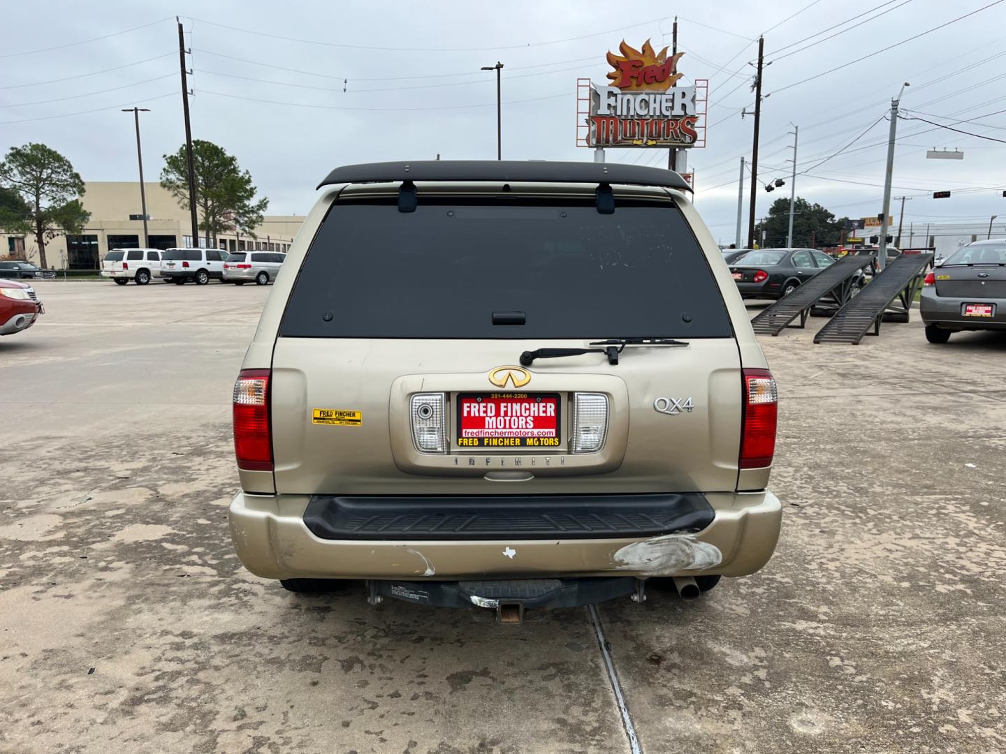 2003 tan /TAN Infiniti QX4 4WD (JNRDR09Y53W) with an 5 engine, 4-Speed Automatic Overdrive transmission, located at 14700 Tomball Parkway 249, Houston, TX, 77086, (281) 444-2200, 29.928619, -95.504074 - Photo#5